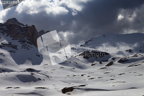 Image of Snowy mountains in storm clouds