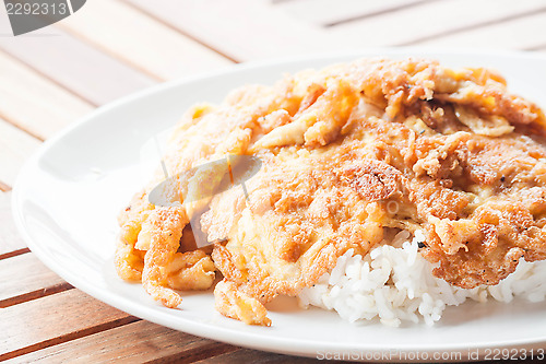 Image of Classical plain egg omelet topped on rice 