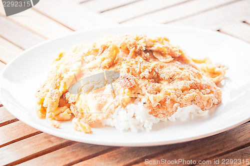 Image of Plain egg omelet top on cooked rice