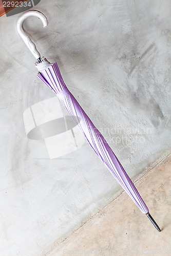 Image of Violet uv protection umbrella on the floor