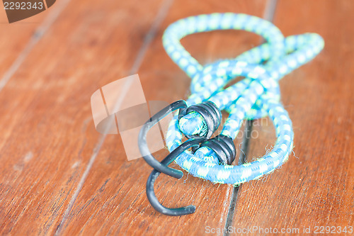 Image of Light blue elastic rope with metal hooks 