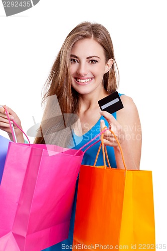 Image of attractive young woman with colorful shopping bags isolated