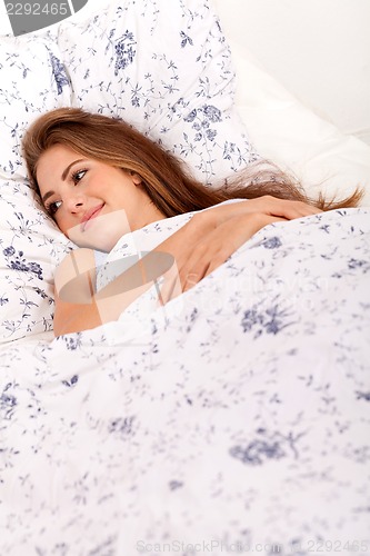 Image of young brunette woman lying in bed sleeping morning 