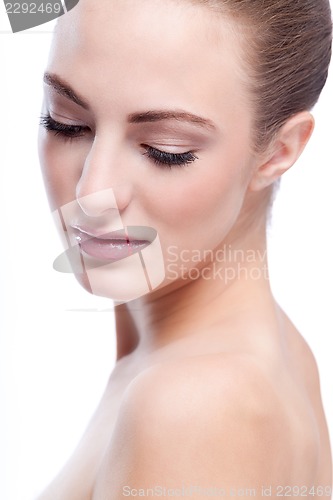 Image of beautiful young woman with perfect skin and soft makeup 