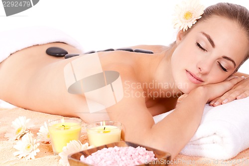 Image of young attractive woman hot stone massage wellness isolated