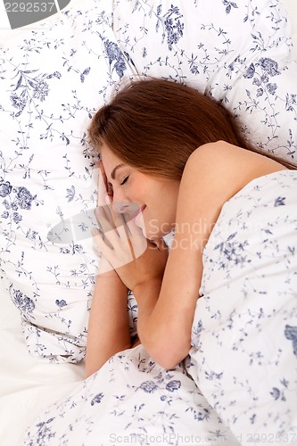 Image of young brunette woman lying in bed sleeping morning 