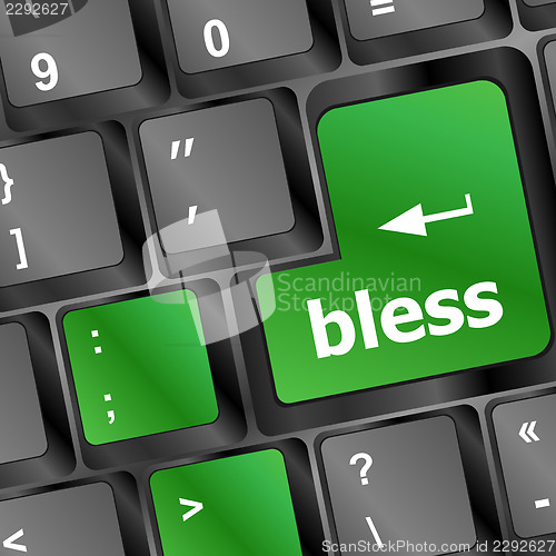Image of bless text on computer keyboard key - business concept