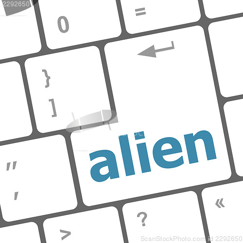 Image of alien on computer keyboard key enter button