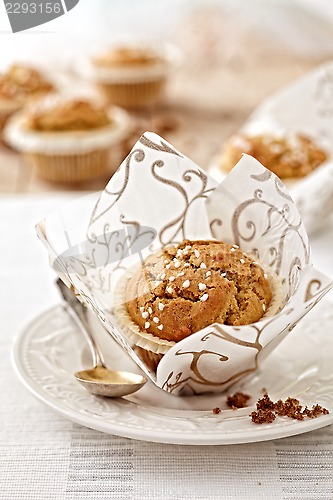 Image of freshly baked muffin on white plate