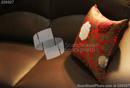 Image of Pillow on a leather sofa