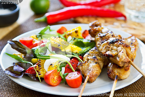 Image of Grilled chicken skewer with salad