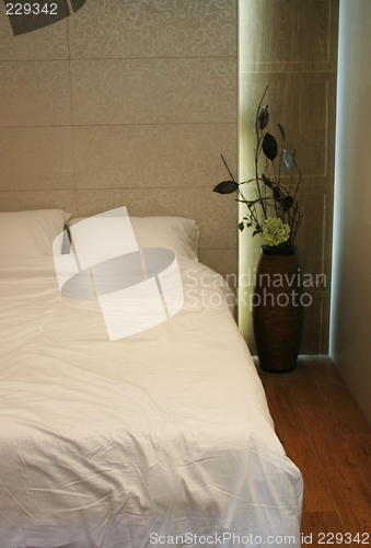 Image of Double bed with white sheets and pillows