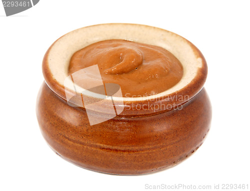 Image of French mustard served in a small ceramic pot