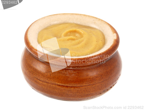 Image of Dijon mustard served in a small ceramic pot