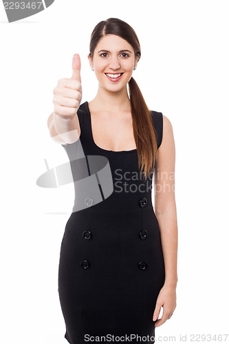 Image of Attractive female gesturing thumbs up