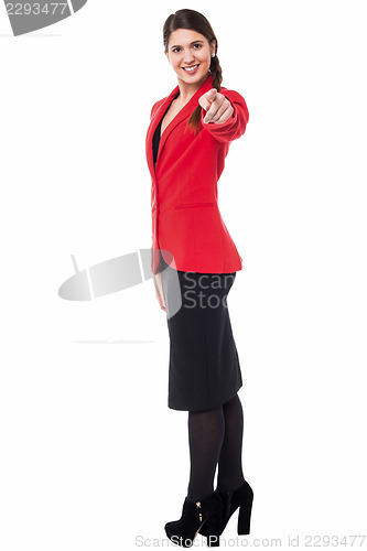 Image of Stylish corporate woman pointing at you