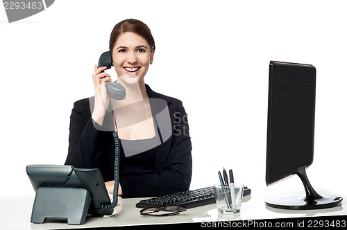 Image of Female secretary answering phone call