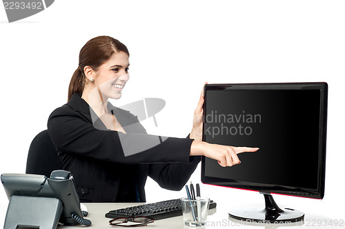 Image of Lady pointing on blank computer screen