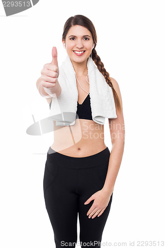 Image of  Fitness lady showing success gesture