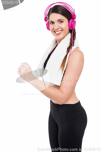 Image of Girl enjoying music while working out