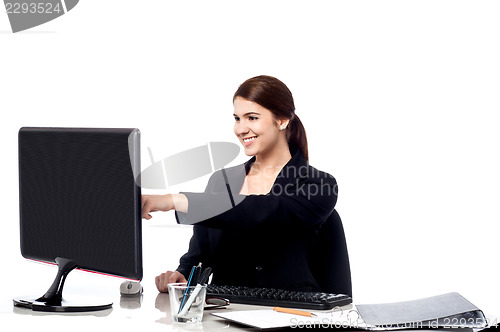 Image of Female staff pointing at monitor screen