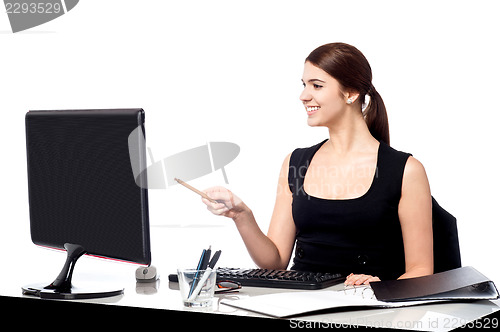 Image of Female assistant at her work desk