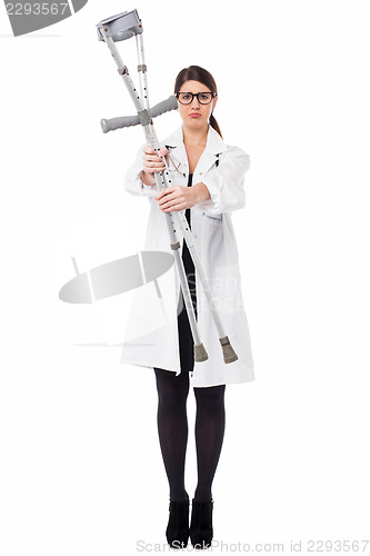 Image of Medical expert holding up the crutches