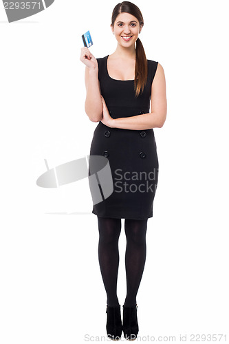 Image of Beautiful woman holding up cash card