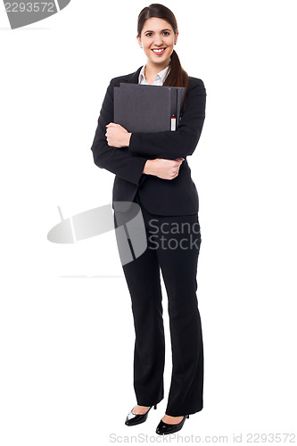 Image of Pretty secretary holding business files