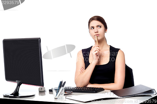 Image of Lady thinking of a solution for client's query