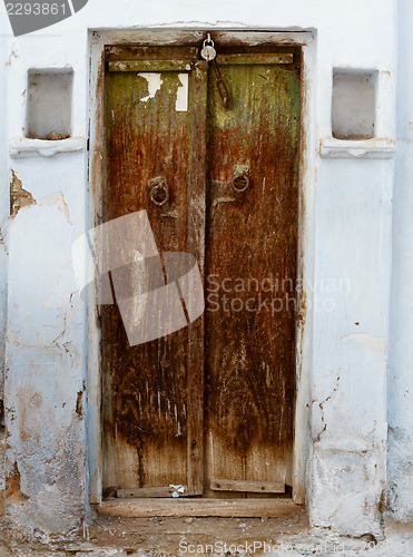 Image of Rotten wooden door of an old house. India, Udaipur