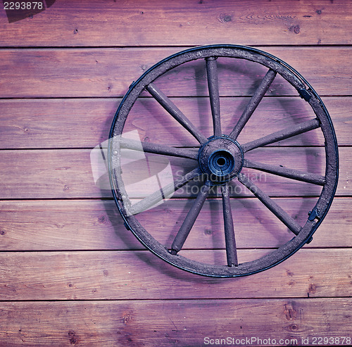 Image of Vintage wooden wheel on wall