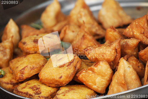 Image of Traditional Indian dish samosa on the open market