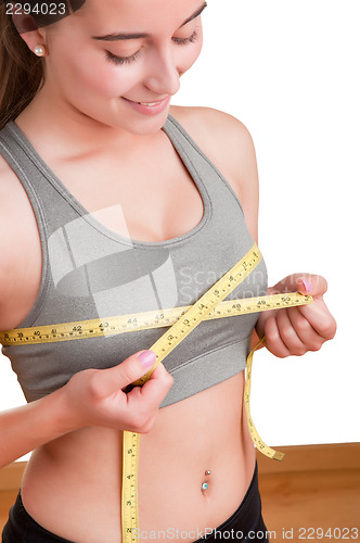 Image of Woman Measuring Up Her Chest