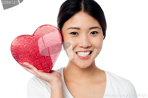 Image of Woman displaying her valentine gift