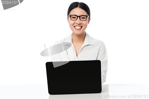 Image of Smiling corporate lady with laptop