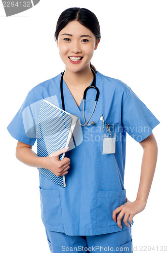 Image of Female doctor holding patients records