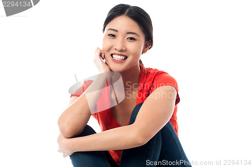 Image of Pretty asian girl smiling heartily