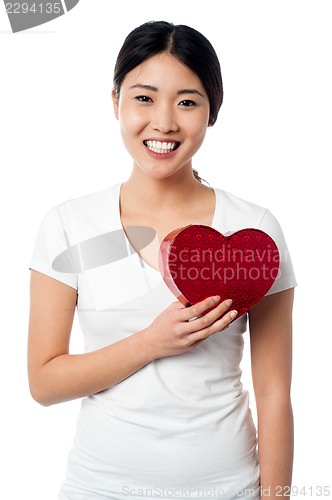 Image of Smiling pretty girl with love heart
