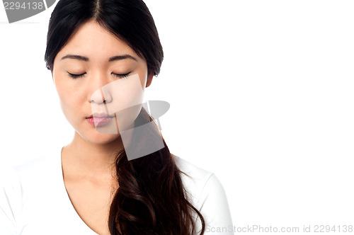 Image of Young girl with closed eyes at peace