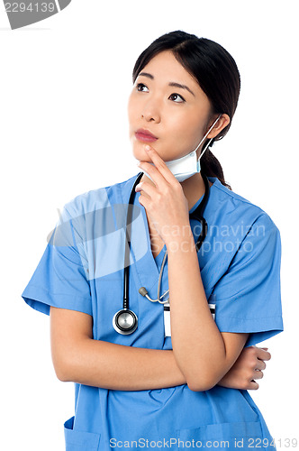 Image of Female surgeon thinking something