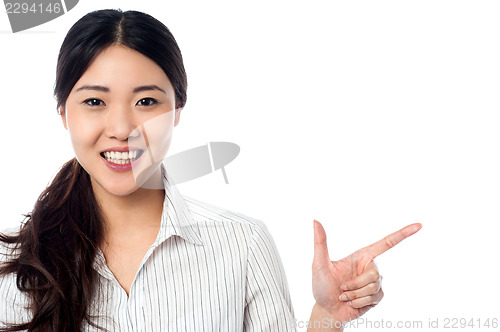 Image of Young pretty model pointing away
