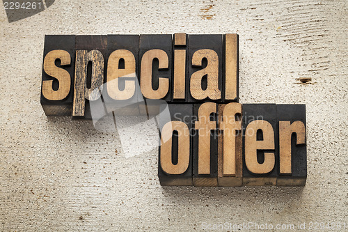 Image of special offer sign in wood type