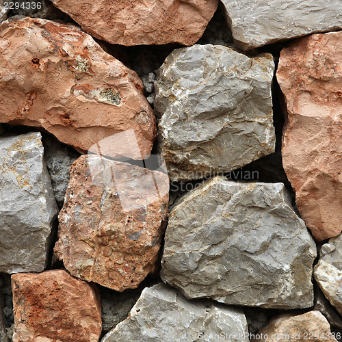 Image of Rough hewn stone forming a wall