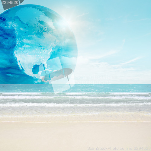 Image of America globe on tropical beach