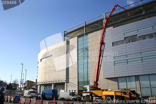 Image of cement being pumped into new building