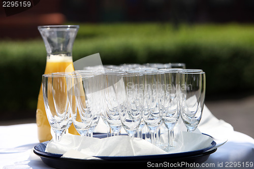 Image of closeup many glasses and juice