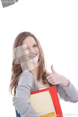 Image of Happy young woman giving a thumbs up