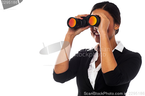 Image of Corporate woman viewing through binoculars