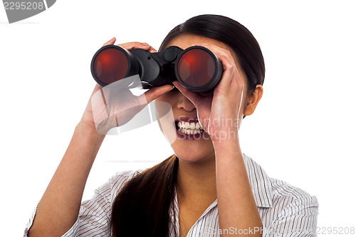 Image of Corporate woman viewing through binoculars